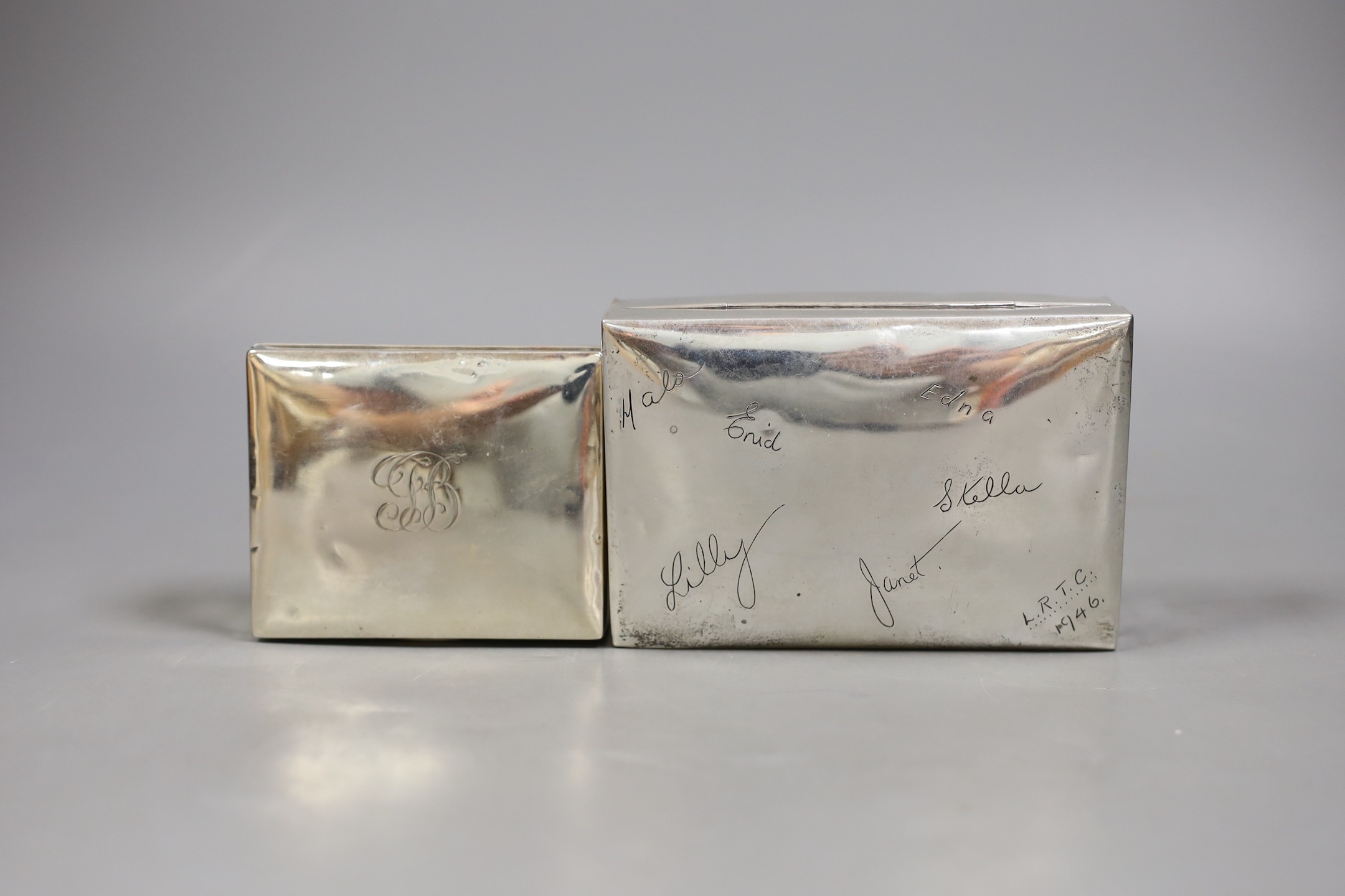 A George V silver mounted cigarette box, William Hutton & Sons, Birmingham, 1917, 89mm and a later larger Egyptian white metal cigarette box.